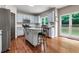 Light and airy kitchen with island, stainless appliances, granite counters and backyard view at 5741 Stonekirk Walk Northwest, Acworth, GA 30101