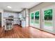 Bright kitchen with hardwood floors, stainless appliances, and large windows to the backyard at 5741 Stonekirk Walk Northwest, Acworth, GA 30101