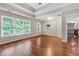 Spacious living room with tray ceilings, hardwood floors, and lots of natural light at 5741 Stonekirk Walk Northwest, Acworth, GA 30101
