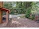 Landscaped backyard featuring a patio area, well-maintained lawn, and lush greenery at 834 Lake Hollow Sw Blvd, Marietta, GA 30064