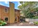 Charming backyard featuring a screened in porch and mature trees at 834 Lake Hollow Sw Blvd, Marietta, GA 30064