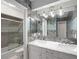 Bathroom features double vanity, marble counter tops, contemporary lighting and tiled shower at 834 Lake Hollow Sw Blvd, Marietta, GA 30064