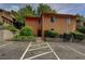 Exterior of two-story home showcasing landscaping, parking and community feel at 834 Lake Hollow Sw Blvd, Marietta, GA 30064