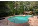 Community pool featuring a large swimming pool, lounge chairs and clubhouse at 834 Lake Hollow Sw Blvd, Marietta, GA 30064