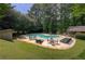 Community pool featuring lounge chairs and picnic tables at 834 Lake Hollow Sw Blvd, Marietta, GA 30064