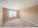 Cozy bedroom with carpet, a window, and neutral paint, offering a comfortable space at 1057 Cotton Oak Dr, Lawrenceville, GA 30045