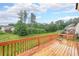 Lovely wood deck overlooks backyard space with mature trees, grill and natural privacy at 1057 Cotton Oak Dr, Lawrenceville, GA 30045
