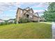 Two-story home with brick and siding, a well-manicured lawn and a welcoming front porch at 1057 Cotton Oak Dr, Lawrenceville, GA 30045