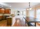 Open kitchen with granite counters, stainless appliances flowing into the living room at 1057 Cotton Oak Dr, Lawrenceville, GA 30045