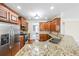 Kitchen with granite counters, stainless steel appliances, and custom cabinets at 1057 Cotton Oak Dr, Lawrenceville, GA 30045