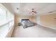 Large main bedroom with trey ceiling, fan, neutral walls, and carpeted flooring at 1057 Cotton Oak Dr, Lawrenceville, GA 30045