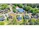 Aerial view of the home and surrounding neighborhood with a pool and tennis court at 1807 N Chestnut Grove Dr, Marietta, GA 30066
