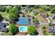 Aerial view of two-story home in community with pool and tennis courts at 1807 N Chestnut Grove Dr, Marietta, GA 30066
