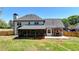Back of home featuring covered porch, patio, and fenced yard at 1807 N Chestnut Grove Dr, Marietta, GA 30066