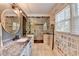 Bathroom featuring double sinks and a glass-enclosed shower with dual shower heads at 1807 N Chestnut Grove Dr, Marietta, GA 30066