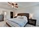 Comfortable bedroom featuring a tufted headboard bed and a neutral color palette at 1807 N Chestnut Grove Dr, Marietta, GA 30066