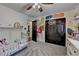 Cozy bedroom with floral mural, closet, and single bed, a perfect space for play at 1807 N Chestnut Grove Dr, Marietta, GA 30066