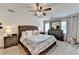 Comfortable bedroom featuring a tufted headboard bed and a neutral color palette at 1807 N Chestnut Grove Dr, Marietta, GA 30066
