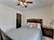 Comfortable bedroom with dark wood furniture and calming blue comforter at 1807 N Chestnut Grove Dr, Marietta, GA 30066