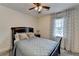 Cozy bedroom featuring neutral decor, a ceiling fan, and natural light at 1807 N Chestnut Grove Dr, Marietta, GA 30066