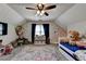 Playful bedroom with sloped ceilings, polka dot walls, and colorful decor at 1807 N Chestnut Grove Dr, Marietta, GA 30066
