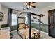 A room features a stylish bed and dinosaur-themed decor for a creative atmosphere at 1807 N Chestnut Grove Dr, Marietta, GA 30066