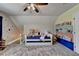 Charming bedroom features a daybed, ceiling fan, and colorful wall decor for a playful touch at 1807 N Chestnut Grove Dr, Marietta, GA 30066