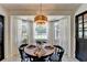 The breakfast nook has a lot of natural light and a view of the backyard at 1807 N Chestnut Grove Dr, Marietta, GA 30066