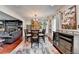 Open-concept dining area with hardwood floors, modern light fixture, and stylish decor at 1807 N Chestnut Grove Dr, Marietta, GA 30066