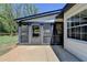 Home exterior showing a covered patio and adjacent concrete area at 1807 N Chestnut Grove Dr, Marietta, GA 30066