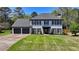 Charming two-story home with painted brick, black shutters, and a well-manicured lawn at 1807 N Chestnut Grove Dr, Marietta, GA 30066