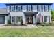 Close up view of the front door showcasing fresh mulch, a beautiful glass door, and an American flag at 1807 N Chestnut Grove Dr, Marietta, GA 30066