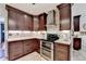Stunning kitchen with dark cabinets, stainless steel appliances and tiled backsplash at 1807 N Chestnut Grove Dr, Marietta, GA 30066