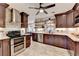 Beautiful kitchen featuring stainless steel appliances, dark cabinets and an open concept to the dining area at 1807 N Chestnut Grove Dr, Marietta, GA 30066