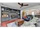 Bright living room features a fireplace, built-ins, and an open layout into the dining area at 1807 N Chestnut Grove Dr, Marietta, GA 30066