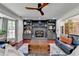 Inviting living room with a fireplace, built-in shelves, and a large window for natural light at 1807 N Chestnut Grove Dr, Marietta, GA 30066
