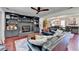 Open-concept living area with fireplace, built-in shelving, and seamless flow into dining at 1807 N Chestnut Grove Dr, Marietta, GA 30066