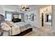 The spacious main bedroom has carpet flooring, a large bed, and plenty of natural light at 1807 N Chestnut Grove Dr, Marietta, GA 30066