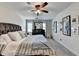 Relax in this elegant main bedroom with a cozy bed, soft carpet, and stylish decor at 1807 N Chestnut Grove Dr, Marietta, GA 30066
