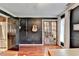 Elegant office space featuring dark walls, hardwood floors and french doors with an open doorway at 1807 N Chestnut Grove Dr, Marietta, GA 30066