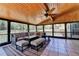 Spacious screened-in patio with wood ceiling, lounge seating, and outdoor rugs at 1807 N Chestnut Grove Dr, Marietta, GA 30066