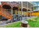 Backyard area with fire pit and seating area beneath a deck and porch at 261 Ormond Se St, Atlanta, GA 30315