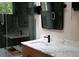 Well-lit bathroom features glass shower doors and marble countertop at 261 Ormond Se St, Atlanta, GA 30315