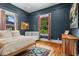 Bright bedroom features hardwood floors, a crib, and neutral walls at 261 Ormond Se St, Atlanta, GA 30315