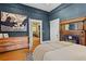 Bedroom boasts hardwood floors, artwork, and decorative fireplace at 261 Ormond Se St, Atlanta, GA 30315