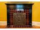 Ornate tiled fireplace with decorative detail and dark wood trim complements this home's interior at 261 Ormond Se St, Atlanta, GA 30315