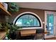 Home office boasts wood floors, built-in shelves, and transom window at 261 Ormond Se St, Atlanta, GA 30315