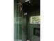 Modern shower with unique green tiling, glass door and a view to the outdoors at 261 Ormond Se St, Atlanta, GA 30315