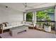 Inviting sunroom with comfortable seating and views of the lush backyard at 261 Ormond Se St, Atlanta, GA 30315