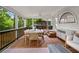 Sunroom featuring ample natural light and a spacious dining area for entertaining at 261 Ormond Se St, Atlanta, GA 30315